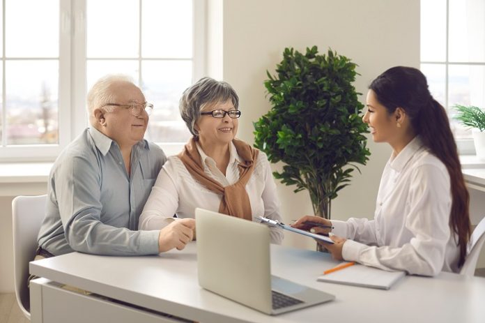 Old senior couple contract meeting financial adviser bank manager for investment